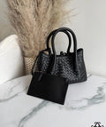 Borsa nera in pelle intrecciata