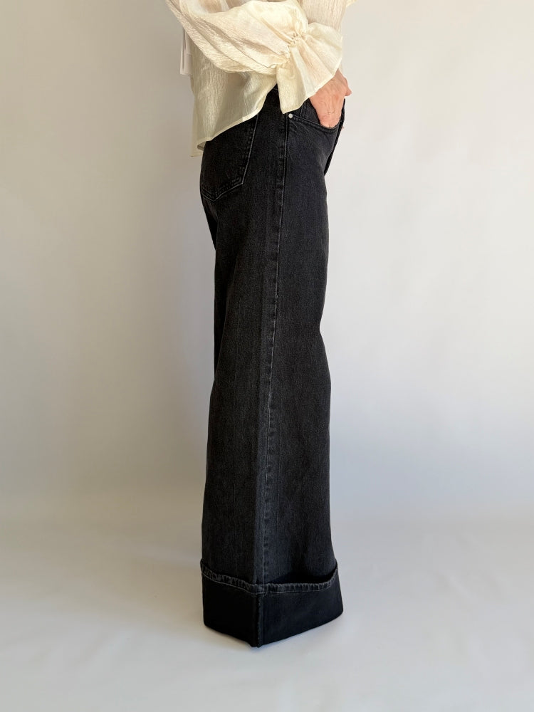 Jeans nero zampa larga  con risvoltone