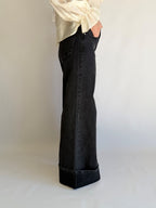 Jeans nero zampa larga  con risvoltone